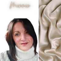 a woman wearing a turtle neck sweater next to a beige silk fabric