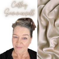 a woman with a beige hair and a beige silk fabric